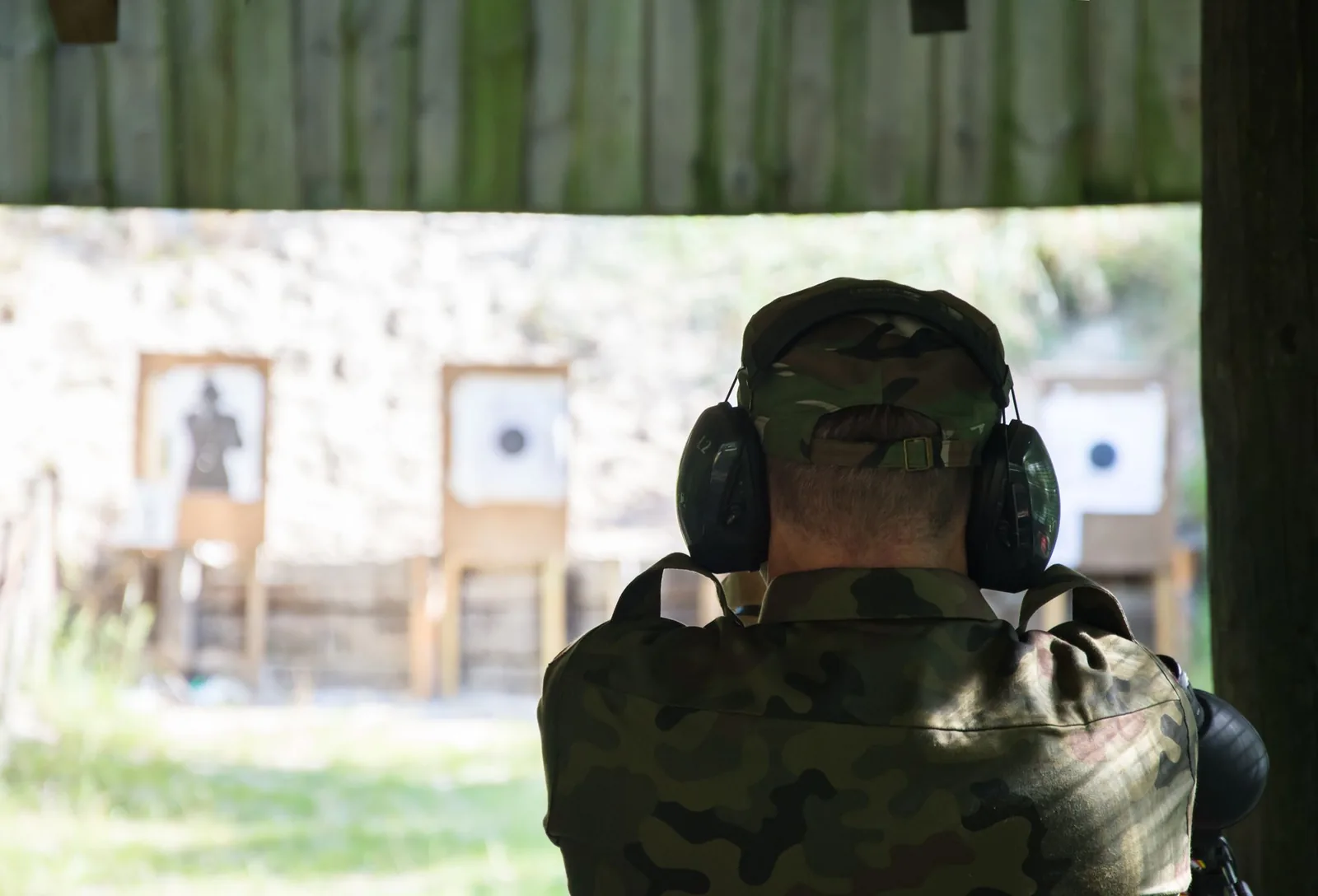 Shooter at the outdoor range with hearing protection