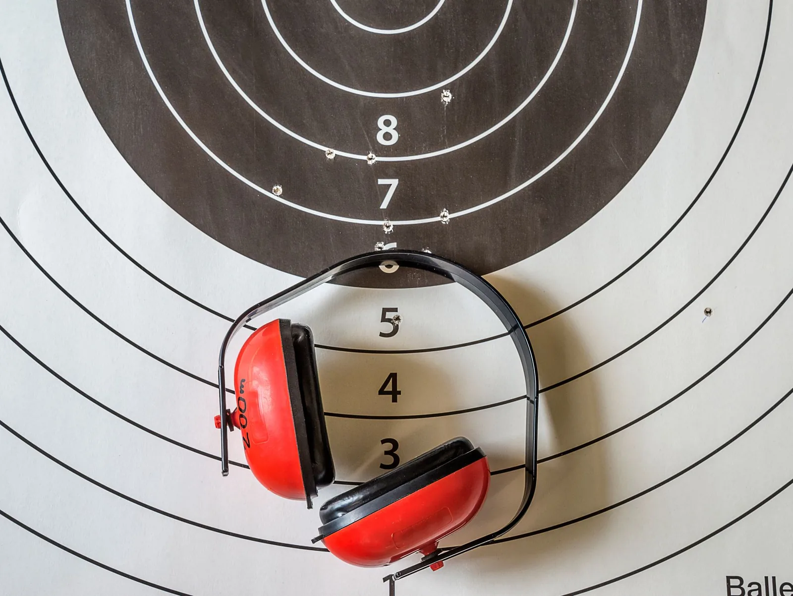Paper target and hearing protection close-up